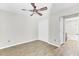 Bedroom with ceiling fan, closet, and an ensuite bathroom with a shower and tub at 703 Temple Rd # A, Ladson, SC 29456