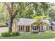 Well-maintained home showcasing a lush yard and mature trees in a residential neighborhood at 703 Temple Rd # A, Ladson, SC 29456