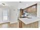 Bright kitchen with stainless steel appliances, stone countertops, and wood cabinets at 703 Temple Rd # A, Ladson, SC 29456