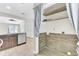 View of the laundry with tile backsplash and curtain rods in an open space near the kitchen at 703 Temple Rd # A, Ladson, SC 29456