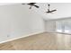 Spacious living room featuring high ceilings, ceiling fans, and access to a patio at 703 Temple Rd # A, Ladson, SC 29456