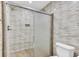 Modern walk-in shower with a glass door, sleek fixtures, and stylish tile at 703 Temple Rd # A, Ladson, SC 29456