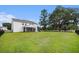 Beautiful backyard with a fenced yard and mature trees at 7045 Stonecrop Ln, Johns Island, SC 29455