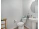 Elegant powder room with pedestal sink, modern fixtures and neutral paint at 7045 Stonecrop Ln, Johns Island, SC 29455