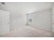 A simple bedroom featuring a window and neutral colored carpet at 7045 Stonecrop Ln, Johns Island, SC 29455