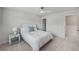 Bright bedroom with a queen-sized bed, a ceiling fan, and side tables with lamps at 7045 Stonecrop Ln, Johns Island, SC 29455