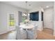 Charming breakfast nook with table and chairs, providing a cozy dining space next to the exterior door at 7045 Stonecrop Ln, Johns Island, SC 29455