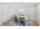 Cozy dining area with a table set for four, bright and full of light from the window at 7045 Stonecrop Ln, Johns Island, SC 29455