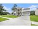 Charming two-story home with double porch, lush front lawn, and a convenient attached garage at 7045 Stonecrop Ln, Johns Island, SC 29455