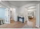 Inviting foyer with wood floors leads to various rooms, showcasing the home's open and airy layout at 7045 Stonecrop Ln, Johns Island, SC 29455
