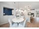 Bright kitchen with a view of a dining area, island with seating and stainless steel appliances at 7045 Stonecrop Ln, Johns Island, SC 29455