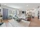 Bright and airy living room featuring stylish furniture and natural light, open to the kitchen at 7045 Stonecrop Ln, Johns Island, SC 29455