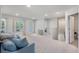 Bright upstairs living room featuring a comfortable sofa and lots of natural light at 7045 Stonecrop Ln, Johns Island, SC 29455