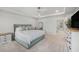Spacious main bedroom with trey ceilings, ceiling fan and ensuite bathroom at 7045 Stonecrop Ln, Johns Island, SC 29455