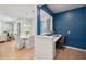 Home office nook with built in desk and bold blue accent wall offering a dedicated workspace at 7045 Stonecrop Ln, Johns Island, SC 29455