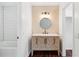 Updated bathroom with new vanity, patterned wallpaper, and white subway tile shower at 747 Brant Rd, Charleston, SC 29414