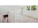 Carpeted room with a window, and an entrance to additional storage space at 747 Brant Rd, Charleston, SC 29414