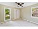 Neutral bedroom with carpet, a ceiling fan, two windows and a bi-fold door closet at 747 Brant Rd, Charleston, SC 29414