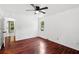 Cozy bedroom with hardwood floors, ceiling fan, and view to the backyard at 747 Brant Rd, Charleston, SC 29414