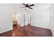Spacious bedroom with hardwood floors, ceiling fan, and ensuite bathroom at 747 Brant Rd, Charleston, SC 29414