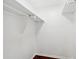 White closet with bar for hanging clothes and wood floors at 747 Brant Rd, Charleston, SC 29414