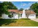 Charming brick home featuring a well-maintained lawn and verdant landscaping at 747 Brant Rd, Charleston, SC 29414
