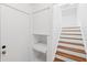 Hallway with wood stairs, a storage cubby, and a door to the basement at 747 Brant Rd, Charleston, SC 29414