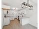 Open kitchen with white cabinets, quartz countertops, and stainless steel appliances at 747 Brant Rd, Charleston, SC 29414