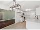 Remodeled kitchen with white cabinets, stainless steel appliances, and modern pendant lighting at 747 Brant Rd, Charleston, SC 29414