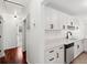 Modern kitchen with white cabinets, stainless steel appliances, and hardwood floors at 747 Brant Rd, Charleston, SC 29414