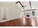 Well-lit living room with wood floors and a fireplace, showcasing natural light at 747 Brant Rd, Charleston, SC 29414