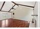Spacious living room featuring vaulted ceiling, exposed wood beams, and hardwood floors at 747 Brant Rd, Charleston, SC 29414
