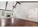 Bright living room with fireplace and hardwood floors open to the kitchen at 747 Brant Rd, Charleston, SC 29414