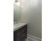 Bathroom features a dark vanity, sink and mirror at 7986 Highway 162, Hollywood, SC 29449