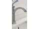 Close-up of a modern chrome faucet with running water over a white undermount sink at 7986 Highway 162, Hollywood, SC 29449