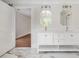 Well-lit bathroom featuring double vanities and a marble floor at 7986 Highway 162, Hollywood, SC 29449