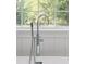 A chrome bathtub faucet set against a window at 7986 Highway 162, Hollywood, SC 29449