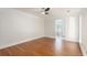 Bedroom with hardwood floors and an ensuite bath, filled with natural light at 7986 Highway 162, Hollywood, SC 29449
