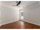 Empty bedroom features hardwood floors, white walls, ceiling fan and a window at 7986 Highway 162, Hollywood, SC 29449