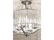 Crystal chandelier with chrome hardware hangs from the ceiling, providing elegant lighting at 7986 Highway 162, Hollywood, SC 29449