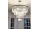Close-up of an elegant, tiered crystal chandelier at 7986 Highway 162, Hollywood, SC 29449