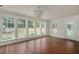 Dining room features hardwood floors, a chandelier, and natural light from the windows at 7986 Highway 162, Hollywood, SC 29449