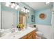 Bathroom featuring double sinks, stylish lighting, and a walk-in shower with neutral tile at 8 Tovey Rd, Charleston, SC 29407