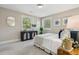Bedroom with a blue cabinet and a queen bed, providing a relaxing retreat at 8 Tovey Rd, Charleston, SC 29407