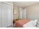 Bedroom with a closet and view to the hall featuring a queen bed with colorful accents and cozy seating at 8 Tovey Rd, Charleston, SC 29407