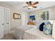 Comfortable bedroom with a ceiling fan, a woven mirror, and a cushioned bench, offering cozy appeal at 8 Tovey Rd, Charleston, SC 29407