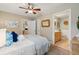 Bedroom with a view of the en suite bathroom featuring a wood vanity and tiled floors at 8 Tovey Rd, Charleston, SC 29407