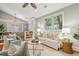 Spacious living room featuring stylish decor, hardwood floors, and a ceiling fan for added comfort at 8 Tovey Rd, Charleston, SC 29407