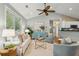 Inviting living room featuring a vaulted ceiling, hardwood floors, an open design and an abundance of natural light at 8 Tovey Rd, Charleston, SC 29407