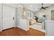 Bright, airy living room with hardwood floors, a ceiling fan, and an open doorway leading to the front door at 8 Tovey Rd, Charleston, SC 29407